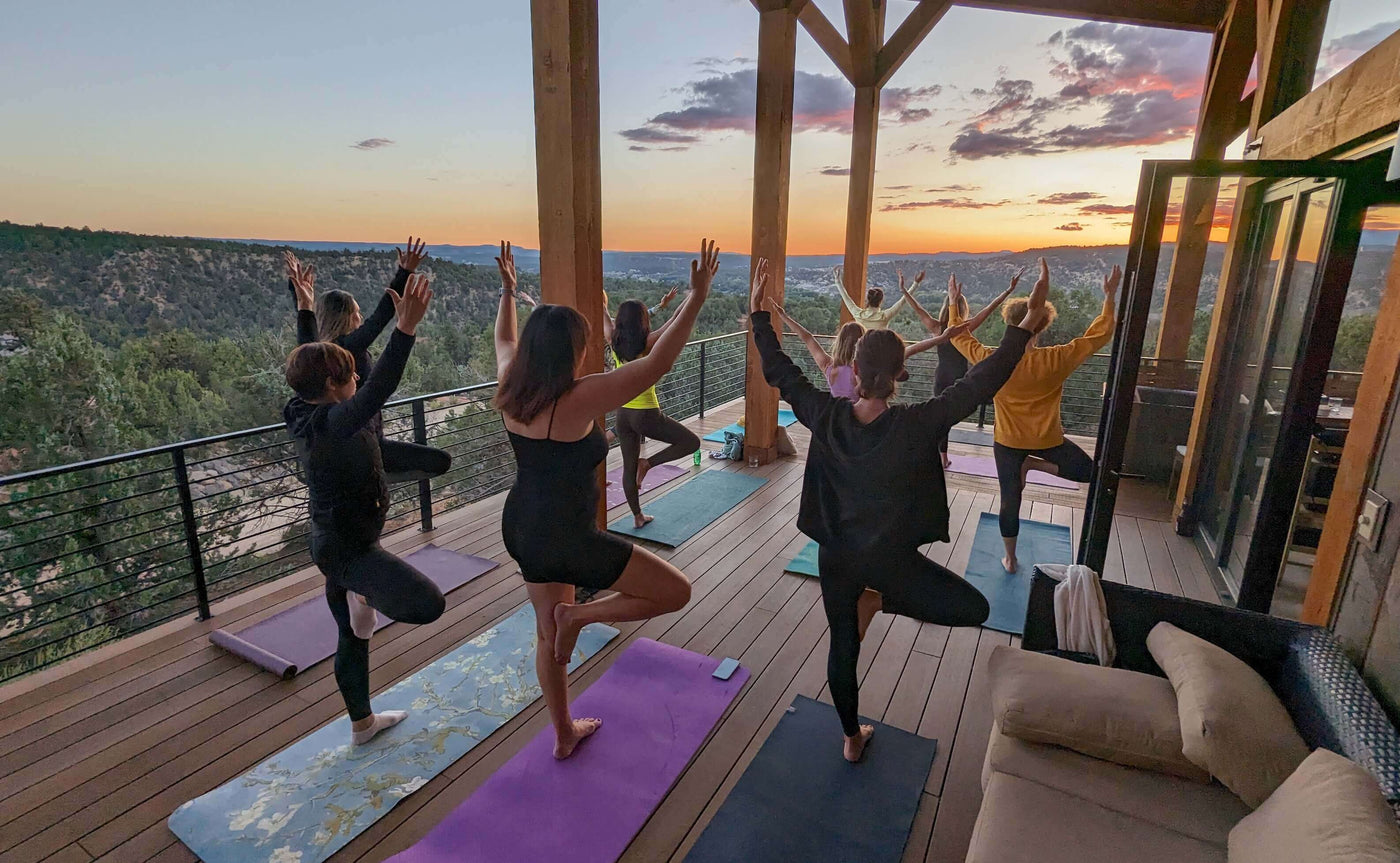 Outdoor yoga on a patio at sunset